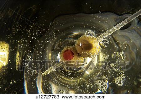 Stock Image - Full Frame, Extreme Close-Up, Luxury, Wine, Stirrer, Olive. Fotosearch