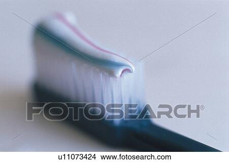 Close Up Image of a Toothbrush that is Putted a Dental Powder, Differential Focus View Large Photo Image Picture - Close Up Image of a Toothbrush that is Putted a Dental Powder, Differential Focus. Fotosearch