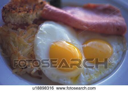 Close Up Image of Eggs Sunny Side Up and Hashed Potato, Differential Focus View Large Photo Image Stock Photograph - Close Up Image of Eggs Sunny Side Up and Hashed Potato, Differential Focus. Fotosearch