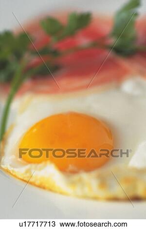 Stock Image - Close Up Image of Ham and Eggs, High Angle View, Differential Focus. Fotosearch