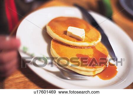 Griddlecake Topped with Butter and Meple Syrup, High Angle View, Close Up, Differential Focus View Large Photo Image Stock Photo - Griddlecake Topped with Butter and Meple Syrup, High Angle View, Close Up, Differential Focus. Fotosearch