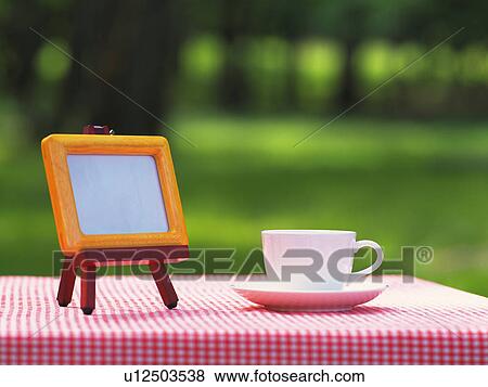 Photo Stand and Tea Cup, Differential Focus, Full Frame View Large Photo Image Stock Photo - Photo Stand and Tea Cup, Differential Focus, Full Frame. Fotosearch