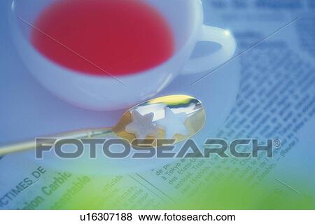 Stock Photo - Tea on the Newspaper, High Angle View, Soft Focus. Fotosearch
