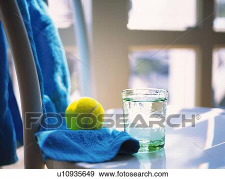 Stock Photo - Tennis Ball, Towel and Glass, Side View, Differential Focus. Fotosearch