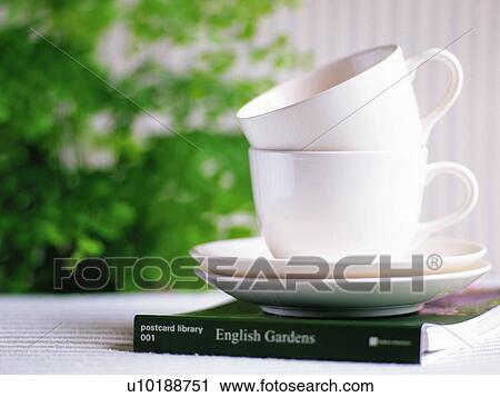 Two Coffee Cups That are Piled on the Book, Close Up, Differential Focus View Large Photo Image Stock Image - Two Coffee Cups That are Piled on the Book, Close Up, Differential Focus. Fotosearch