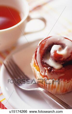 Stock Photograph - Cake on the Plate Served with Tea, High Angle View. Fotosearch