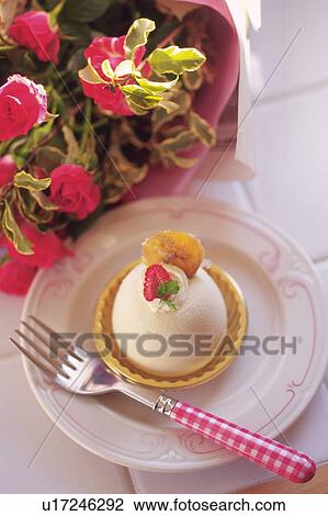 Stock Image - Cake on the Plate with Flowers, High Angle View. Fotosearch