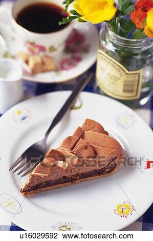 Stock Image - Chocolate Cake on the Plate Served with Coffee, High Angle View. Fotosearch