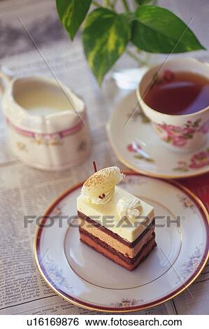 Chocolate Cake on the Plate Served with Tea, High Angle View View Large Photo Image Stock Photograph - Chocolate Cake on the Plate Served with Tea, High Angle View. Fotosearch