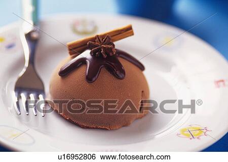 Stock Photograph - Chocolate Ice Cream on the Plate, Close Up. Fotosearch