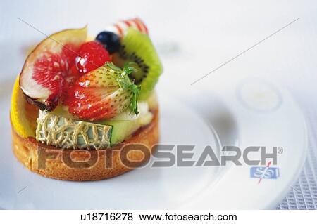 Stock Photo - Fruit Cake on the Plate, High Angle View. Fotosearch