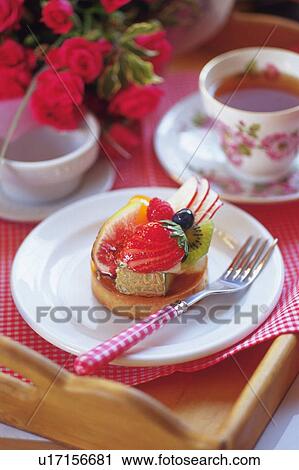Fruit Cake on the Plate Served with Tea, High Angle View View Large Photo Image Stock Image - Fruit Cake on the Plate Served with Tea, High Angle View. Fotosearch