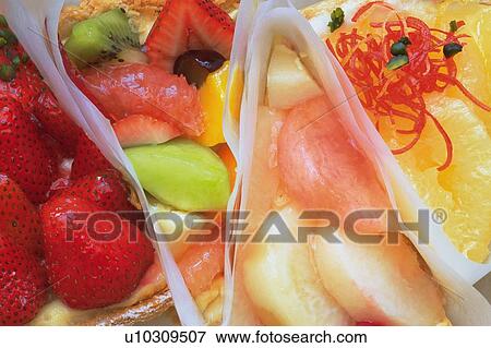 Stock Photo - Full Frame of Fruit Cakes, Close Up. Fotosearch