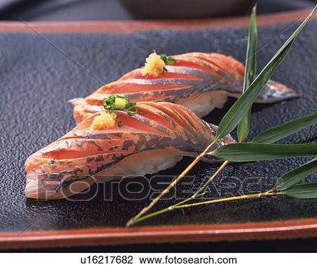Stock Image - Aji, hand shaped sushi. Fotosearch