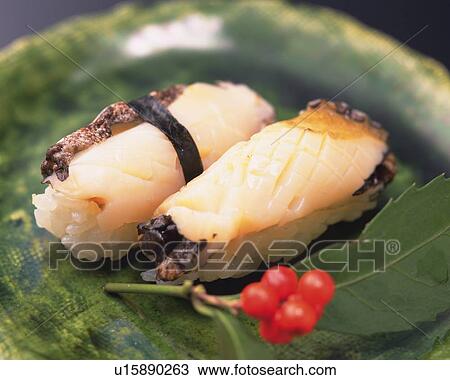 Stock Image - Awabi, hand-shaped sushi. Fotosearch