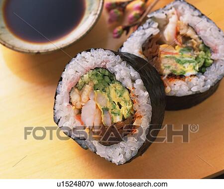 Stock Image - Large rolls, sushi. Fotosearch