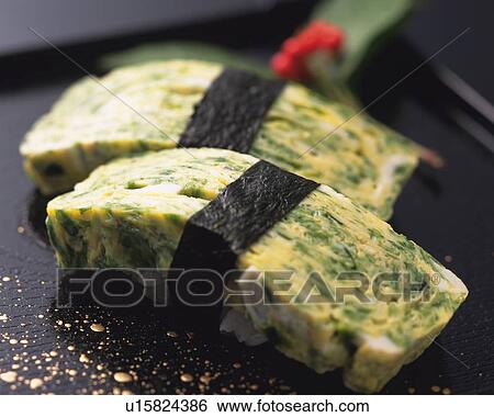 Stock Photograph - Tamago, hand-shaped sushi. Fotosearch