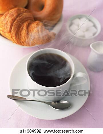 Stock Image - Brend Coffee and Bread, High Angle View, Full Frame. Fotosearch