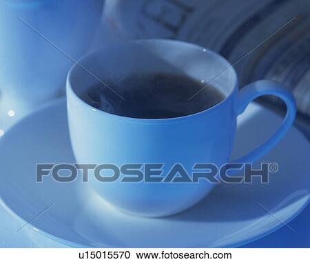 Stock Image - Brend Coffee and Newspaper, Full Frame, Differential Focus, Toned Image. Fotosearch