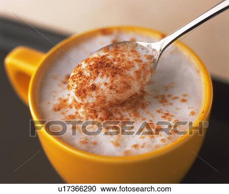 Stock Image - Cappuccino with the Cinnamon Powder, High Angle View, Differential Focus, In Focus, Out Focus, Close Up, Full Frame. Fotosearch