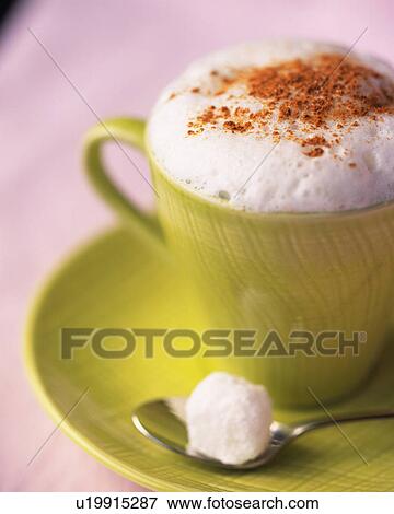 Stock Photo - Cappucino with the Cinnamon Powder, Full Frame, Close Up, Differential Focus. Fotosearch