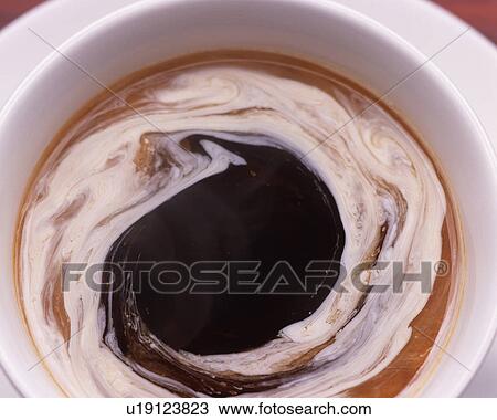 Stock Image - Close Up Image of Brend Coffee with Vortex Milk, High Angle View, Close Up, Full Frame . Fotosearch