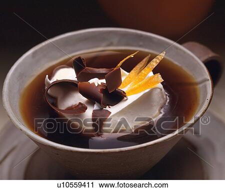 Stock Image - Close Up Image of Coffee with Cream and Chocolate and Orange Peel, Full Frame, Close Up. Fotosearch