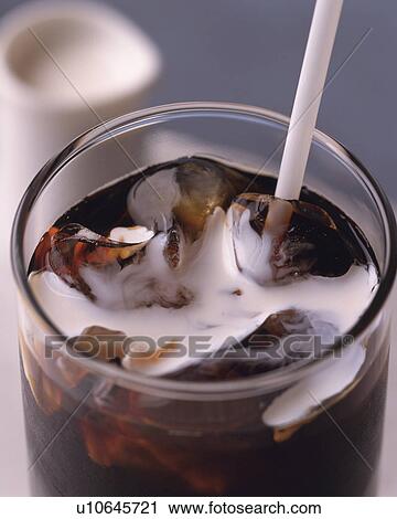 Stock Image - Close Up Image of Ice Coffee with Milk, Close Up, High Angle View, Full Frame, Differential Focus. Fotosearch