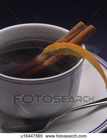 Stock Photography - Coffee with Cinnmon Stick and Orange Peel, Full Frame. Fotosearch