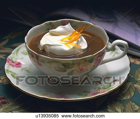 Stock Photography - Coffee with Cream and Orange Peel, Full Frame. Fotosearch