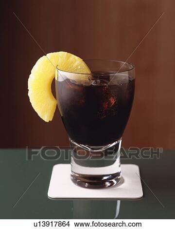 Picture - Drink with Pineapple Rings, Full Frame, Front View. Fotosearch