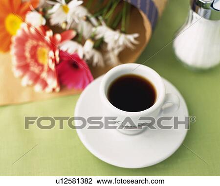 Stock Image - Espresso and Flower, High Angle View, Full Frame, Differential Focus. Fotosearch