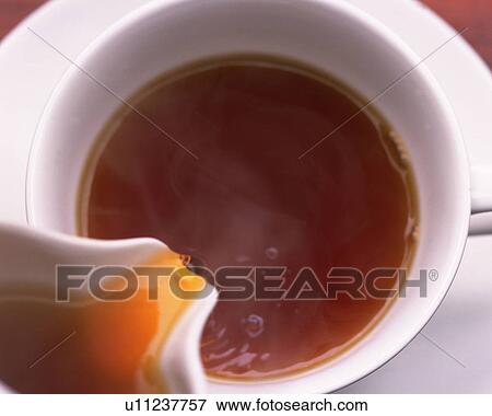 Tea that is Poured in the Cup, High Angle View, Close Up, Full Frame View Large Photo Image Stock Photo - Tea that is Poured in the Cup, High Angle View, Close Up, Full Frame. Fotosearch