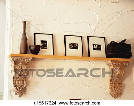 Picture -  a Banquette With Several Pictures on It, Low Angle View. Fotosearch