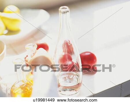 a Hand R Reaching For a Bottle Full of Vinegar, Surrounded By vegetables and other Bottles, High Angle View, Differential Focus View Large Photo Image Stock Photo - a Hand R Reaching For a Bottle Full of Vinegar, Surrounded By vegetables and other Bottles, High Angle View, Differential Focus. Fotosearch