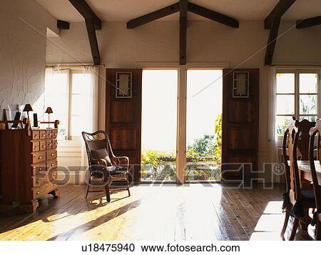a Living Room With Wooden Furniture and a Lot of Light Coming In Through the Window View Large Photo Image Stock Image - a Living Room With Wooden Furniture and a Lot of Light Coming In Through the Window. Fotosearch