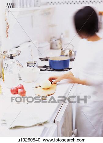 a Mid Adult Woman Cooking in a Kitchen, Side View, Blurred Motion View Large Photo Image Stock Image - a Mid Adult Woman Cooking in a Kitchen, Side View, Blurred Motion. Fotosearch