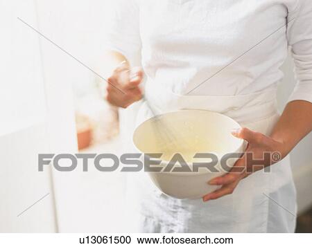 Stock Image -  a Person Cooking, High Angle View. Fotosearch