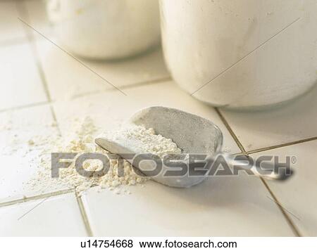 a Silver Scoop With Some Flour in it, Lying on a White Floor, High Angle View View Large Photo Image Stock Photo - a Silver Scoop With Some Flour in it, Lying on a White Floor, High Angle View. Fotosearch