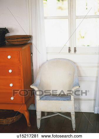 Stock Image -  a White Chair Standing In Front of a Window, High Angle View. Fotosearch