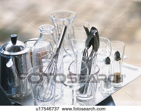 Stock Photo -  Several Glasses, Some Silverware and a Salt and Pepper Shaker, High Angle View, Differential Focus. Fotosearch