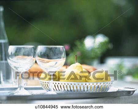 Two Glasses and a Basing Full of Pears on a Table Outdoors, Front View, Differential Focus View Large Photo Image Stock Photography - Two Glasses and a Basing Full of Pears on a Table Outdoors, Front View, Differential Focus. Fotosearch