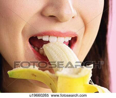 A Woman Eating a Banana, Front View, Close Up View Large Photo Image Stock Photography - A Woman Eating a Banana, Front View, Close Up. Fotosearch