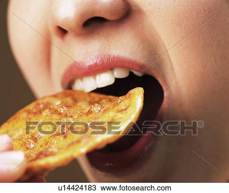 A Woman Eating Rice Cracker, Close Up, Side View View Large Photo Image Stock Image - A Woman Eating Rice Cracker, Close Up, Side View. Fotosearch