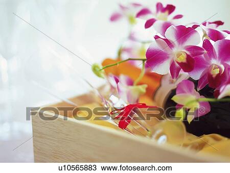 Stock Image - Gift and Empty Wineglass with Red Ribbon. Fotosearch