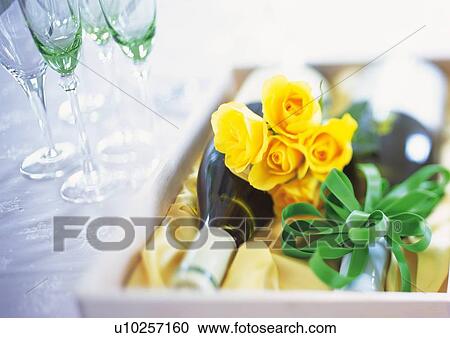 Stock Image - Gift and Empty Wineglasses. Fotosearch