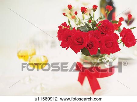 Stock Image - Two Wineglasses and Red Roses. Fotosearch