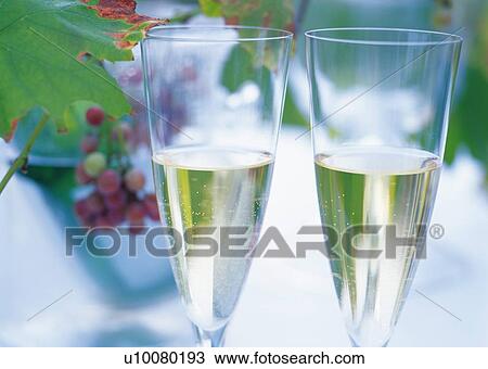 Stock Image - Two Wineglasses, White Wine. Fotosearch