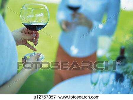 Two Young Women with Wineglasses View Large Photo Image Stock Photo - Two Young Women with Wineglasses. Fotosearch