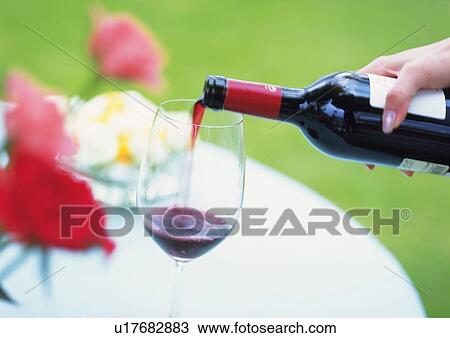 Stock Image - Wineglasses And Red Wine. Fotosearch